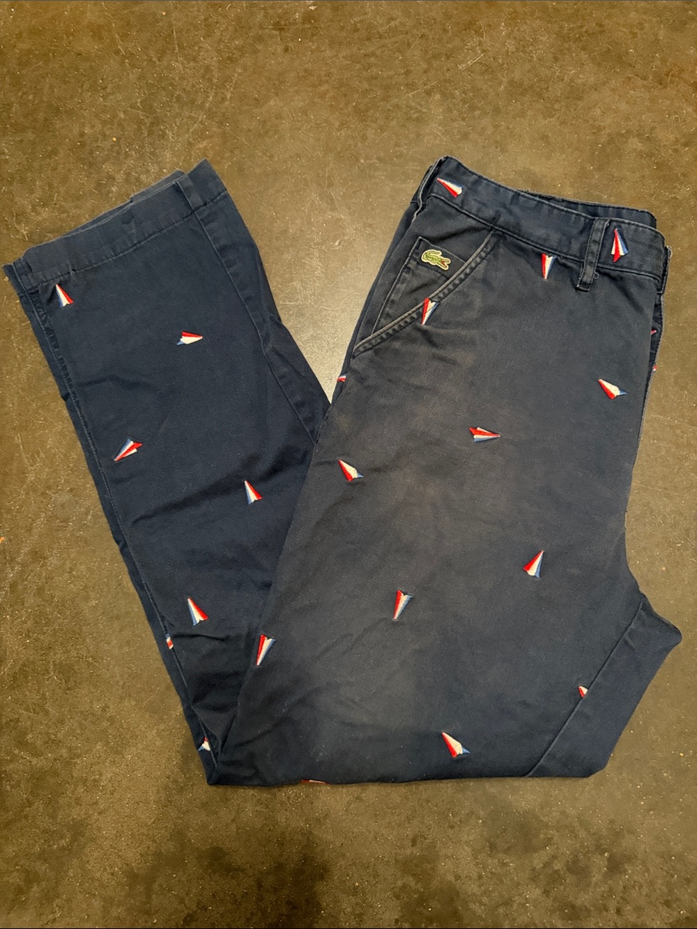 Lacoste Navy Chinos with Red & White Paper Airplane Embroidery